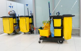 2 carts with cleaning supplies in a commercial building